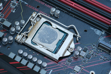 Pc cpu with dried thermal paste on hi tech motherboard,computer components chip