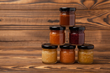 Jar of honey. Fruit honey with berries and nuts.Useful fortified beekeeping product for health and beauty.Cream honey.Vegetarian diet organic product.Copy space. place for text