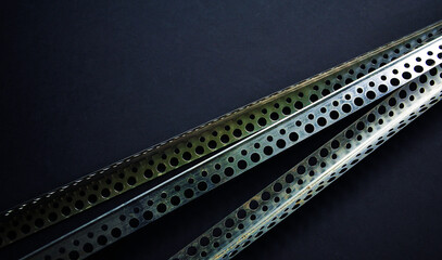 External steel corner beads on a black background