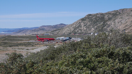 Kangerlussuaq airport in Greenland with cruise ship on horizon