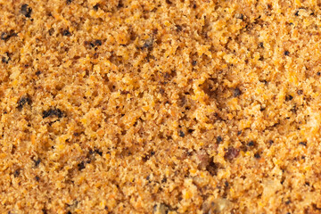 Carrot cake sponge biscuit cut as a background texture. Macro shot