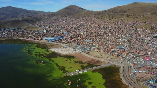 Aerial panorama of Puno with Lake Titicaca in Peru, South America