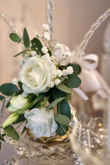 A beautiful wedding bouquet of white roses. Preparation for the wedding.