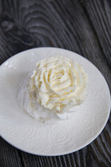 Cake Anna Pavlova, meringue and cream. Lying on a platter, close-up.