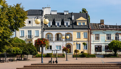 Historic quarter market square with tenement houses and waterworks in old town quarter of Tarnobrzeg in Poland © Art Media Factory