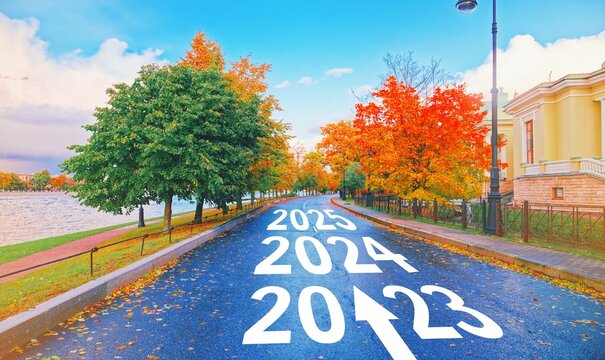 Empty car road drive, arrow sign path view. New year 2023, next goal 2024. Trip way start, travel ahead 2025, end job 2022. Future trend, life plan change, fresh hope growth begin, go forward concept.