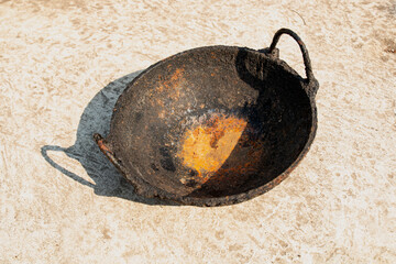 oxidize on cast iron fry pan. corrosion of iron on a pan. Oxidation on iron.