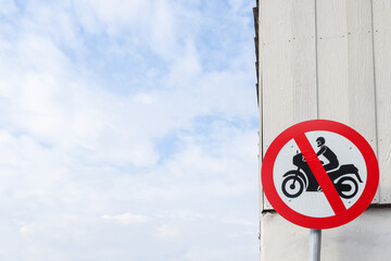 Motorcycle prohibition signs are installed in community areas to prevent motorcycles from entering...