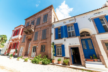 Fototapeta na wymiar CUNDA ISLAND (Alibey Island). Historical old Greek style colorful houses of Cunda. Ayvalik, Balikesir, Turkey.