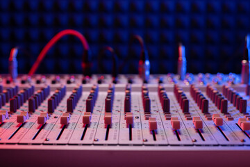 Sound mixer at audio mixing console. Music concept in sound recording studio