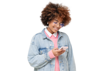 Smiling african american teenage girl with afro hairstyle, holding  phone with one hand, chatting with friend, using social media app, isolated
