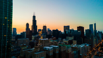 Obraz premium Chicago, IL USA September 15th 2022 : establishing aerial drone view image of Chicago metropolitan city area. the buildings architecture look great for tourist to come and see the skyline