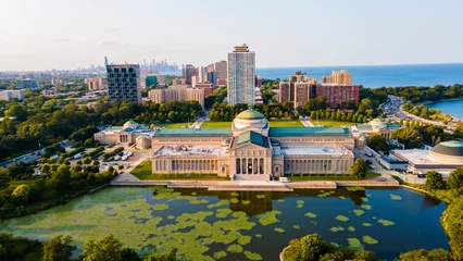 Tuinposter Chicago, IL USA September 16th 2022: Aerial drone footage of the Chicago Museum of Science and industry during the summer time. the view from above is beautiful with the lake water full of life © ezellhphotography