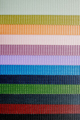 Multicolored fabric background. Variety of color of dense fabric. Color palette