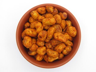 Masala peanuts in a bowl on white background top view 