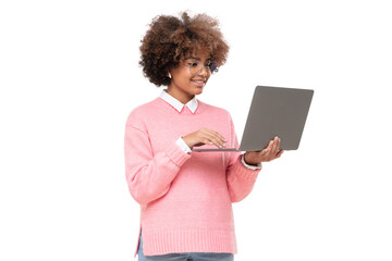 Smiling african american teen girl, high school or online course student holding laptop, isolated