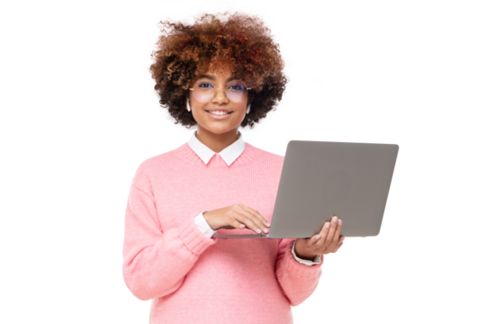 Smiling african american teen girl, high school or online course student holding laptop and looking at camera