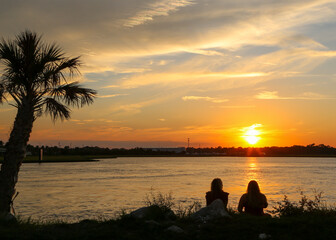 Friends Silhouette Enjoying a Tropical Sunset in Jacksonville Beach