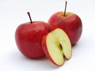 Red apples with half sliced apple isolated on white background 
