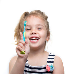Child girl brush her teeth on white background.Toddler dental concept.Tooth hygiene. Toothbrush.
