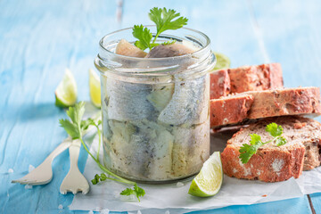 Delicious and fresh pickled fish served with bread and coriander.