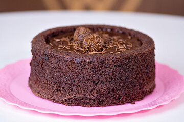 a chocolate cake with brigadeiro in
