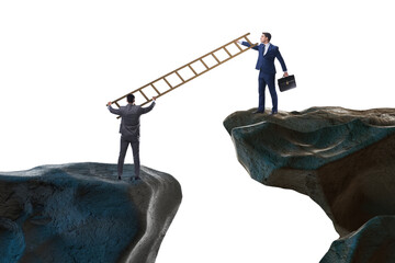 Business people helping to go over chasm