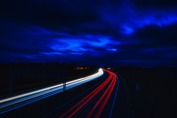 Fototapeta na wymiar Langzeitbelichtung - Autobahn - Strasse - Traffic - Travel - Background - Line - Ecology - Highway - Night Traffic - High quality photo