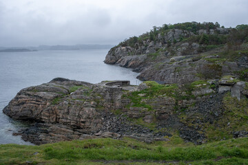 Herdla, Norway - June 16, 2022: Herdla Fort was built by the Germans during Second World War with batteries and bunker facilities. It's completed with a torpedo station in 1944. Selective focus