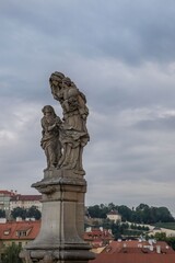 Fototapeta na wymiar Bronze sculpture on the Charles Bridge in Prague, Czech Republic, Bohemia
