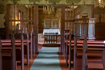 Flam, Norway - June 19, 2022: Flam church is a parish church of the Church of Norway in Aurland Municipality in Vestland county. 17h century. Cloudy spring day. Selective focus