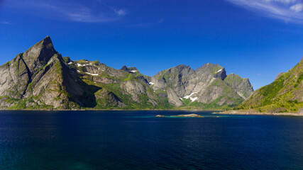 Fototapeta na wymiar Mountains rising out of the sea, in the Lofoten Archipelago