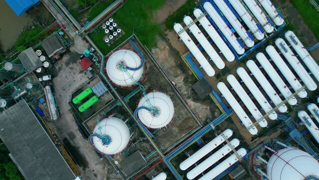 4K : Aerial view from drone flying over a storage tank industry (LNG or LPG), gas refinery, gas factory plant. fuel industry
