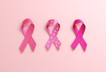 Three pink ribbons isolated on a pink background with copy space for Breast Cancer Awareness Month and World Cancer Day. Flyer, banner design template in 3D illustration
