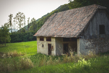 Fototapeta na wymiar Old barn in beautiful natural surroundings during the evening sun.Summer season.