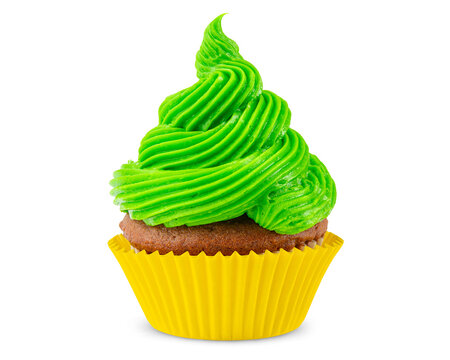 Cupcake. Green, yellow cupcake. Idea cooking. Dessert for party. Chocolate muffin decorated with frosting or Icing. Close-up macro high quality and resolution photo. White Isolated background.