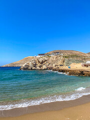 Fototapeta na wymiar Beautiful rocky scenery near Koubara beach in Ios island Cyclades, Greece