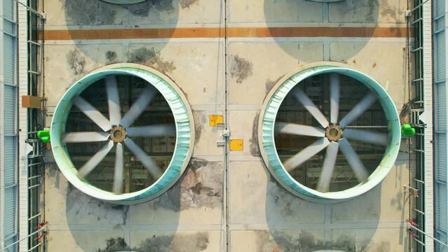 Aerial view from drone flying over industrial cooling tower. 4k stock footage
