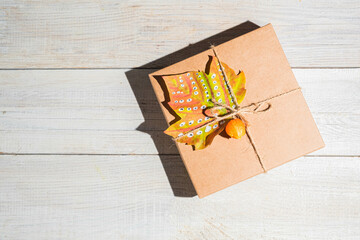 Craft gift box decorated autumn maple leaf. Thanksgiving day