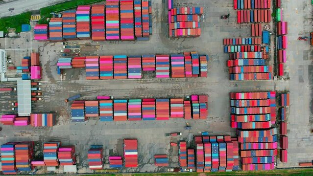 Drone is flying over a logistics park, containers for shipping with semi-trailer trucks. transport industry. logistics concept. 4k
