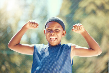 Children, sports and fitness with a strong boy flexing his biceps and having fun with sport...