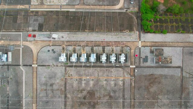 High voltage electrical substation from aerial view, metal poles and electrical wires. electricity industry. energy concept. drones. 4K
