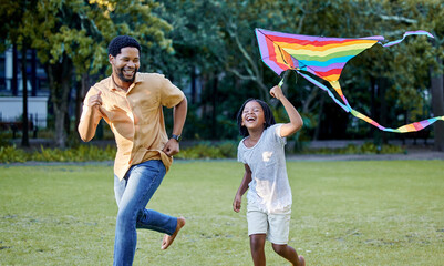 Fototapeta premium Happy girl and father playing a kite while learning or running in a park, garden or lawn outdoor. Black family bonding, fun and happiness while laugh, smile and joy together with cute and daughter