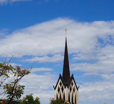 Clouds behind spire of Catholic Church in Wichita. 