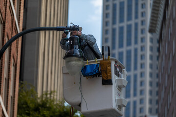 Fixing a street light in downtown Atlanta.