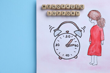 Drawing of woman figure near alarm clock and wooden cubes with words Menopause Symptoms on light...