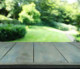 Empty wooden surface outdoors on sunny day. Space for design