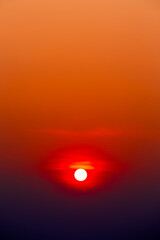 red sun in sunrise sky