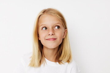 Fototapeta premium Beautiful little girl with blond hair posing studio