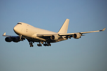 Boeing 747-400 All White Colours cargo Aircraft landing.